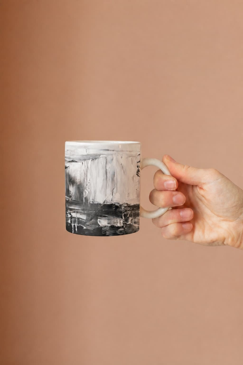 The abstract creator artwork printed on a ceramic mug as a finished goodie.